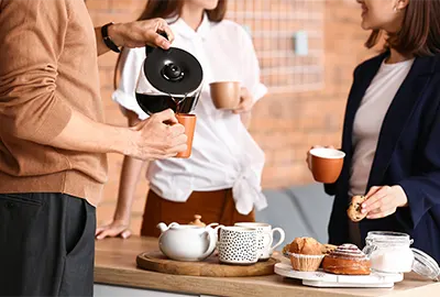 people pouring coffee